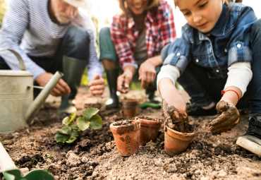 Family gardening with smiley faces